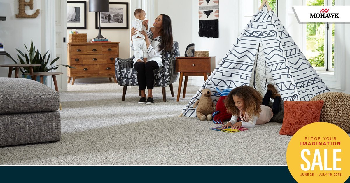 family playing in living area on carpet - Americarpets of Layton, UT
